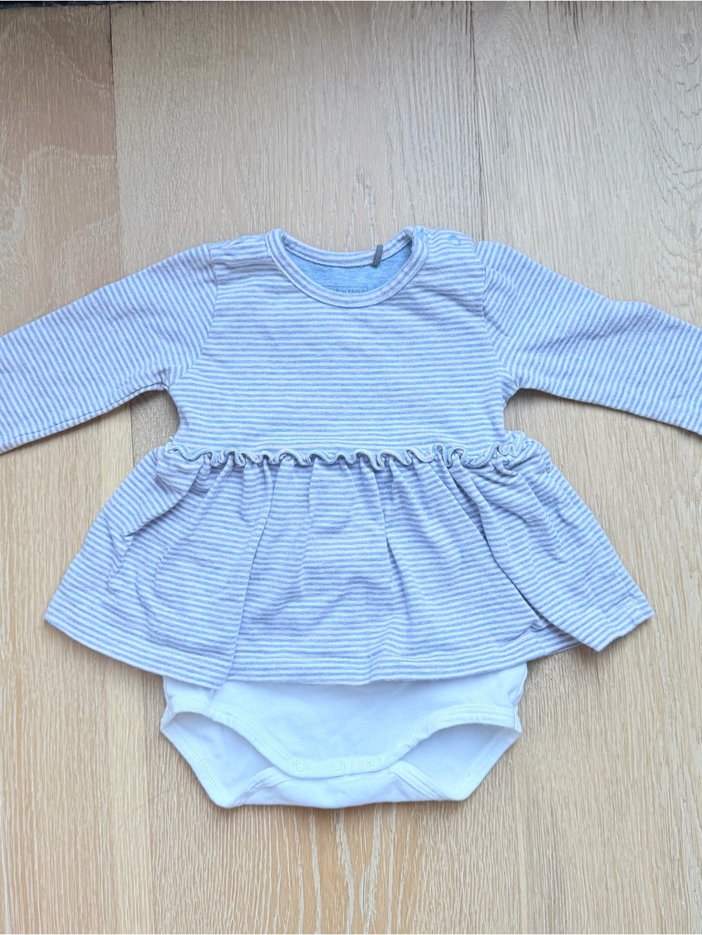 Organic Cotton Long-Sleeve Peplum Bodysuit in Light Blue and Pink Stripe